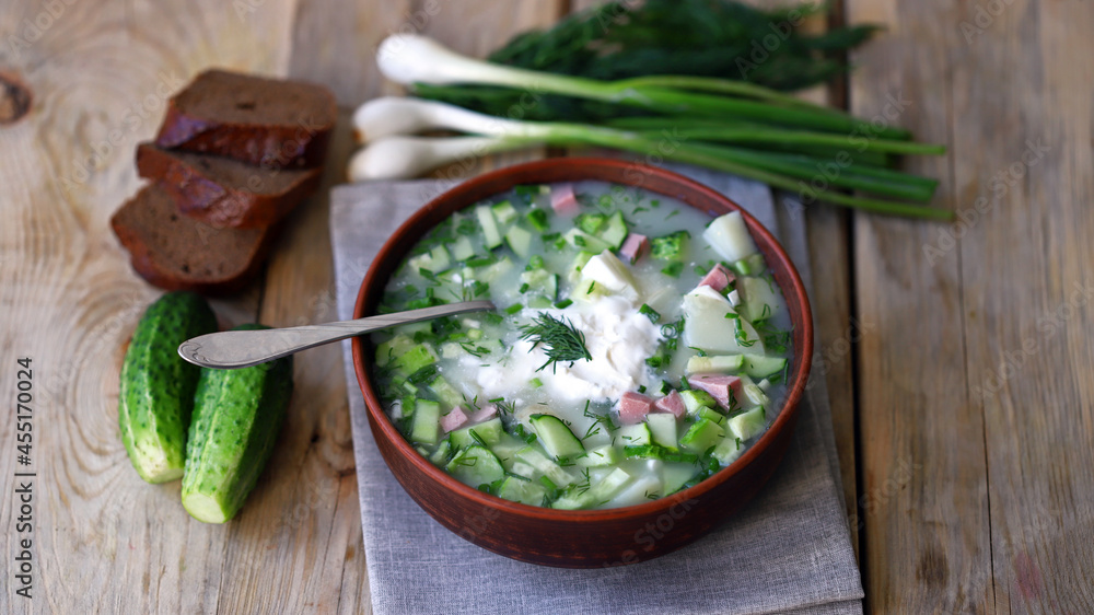 Cold summer soup okroshka with sausage, sour cream and herbs. Cold summer soup okroshka with sausage, sour cream and herbs.