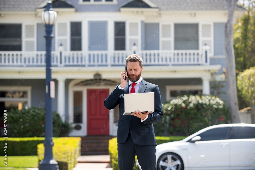 Real estate agent welcoming visitors near new house. Portrait of realtor man. Real estate agent welcoming visitors near new house. Portrait of realtor man.