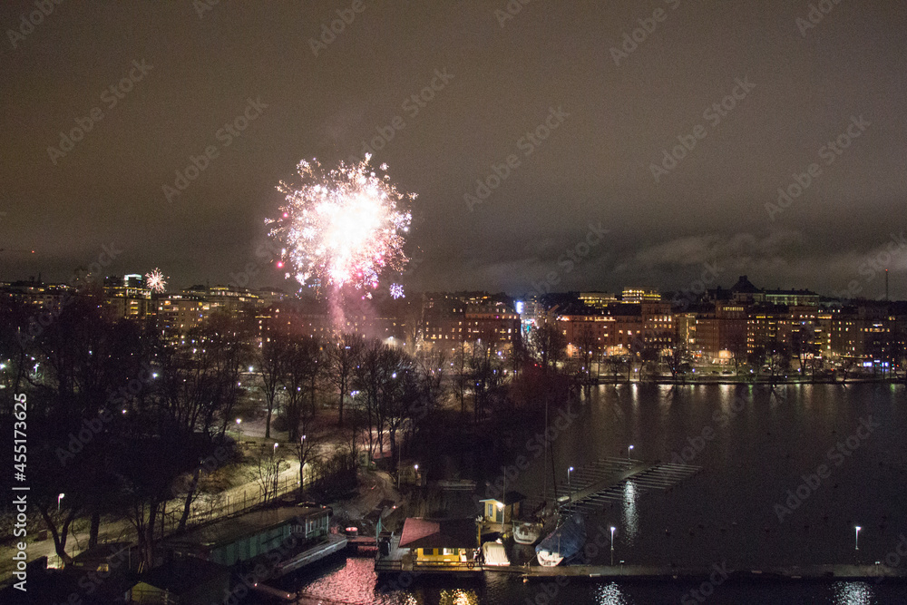 Fototapeta premium Fireworks at Kungsholmen waterfront at night, Stockholm, Sweden.