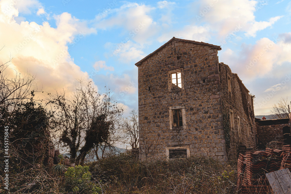 The skeleton of a house destroyed by an earthquake against a blue sky The skeleton of a house destroyed by an earthquake against a blue sky