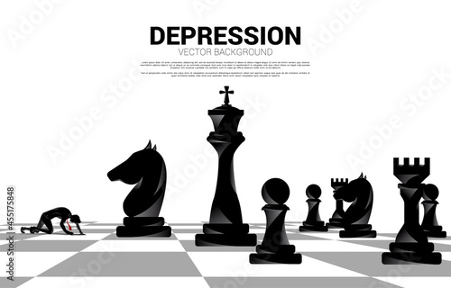 silhouette of businessman crawling on chess board. Concept for depression business in work.