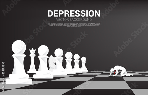 silhouette of businessman crawling on chess board. Concept for depression business in work.