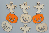 halloween jack o lanterns and ghosts on a gray background
