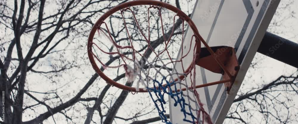 Abandoned basketball hoop torn net Covid 19 pandemic lockdown scenery Abandoned basketball hoop torn net Covid 19 pandemic lockdown scenery