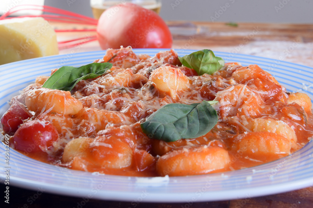 pasta in white sauce with parmesan cheese, tomato, basil, herbs, delicious food from Italian and French cuisine pasta in white sauce with parmesan cheese, tomato, basil, herbs, delicious food from Italian and French cuisine