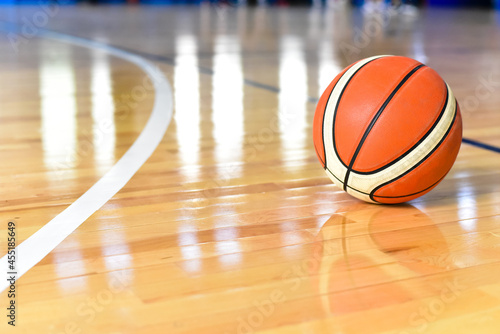Basketball ball on Court Floor close up with blurred background
