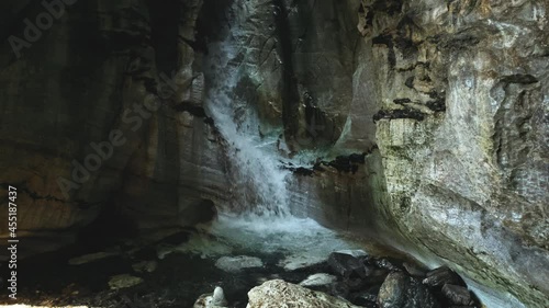 Scenic Cave Waterfall In Grotto Trollkirka, Norway - wide shot photo