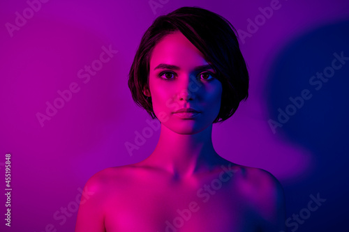 Photo portrait calm girl with bob hairstyle naked shoulders isolated neon color background