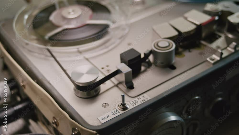 Professional reel to reel recorder. Play, stop, rewind, play. Close up Professional reel to reel recorder. Play, stop, rewind, play. Close up