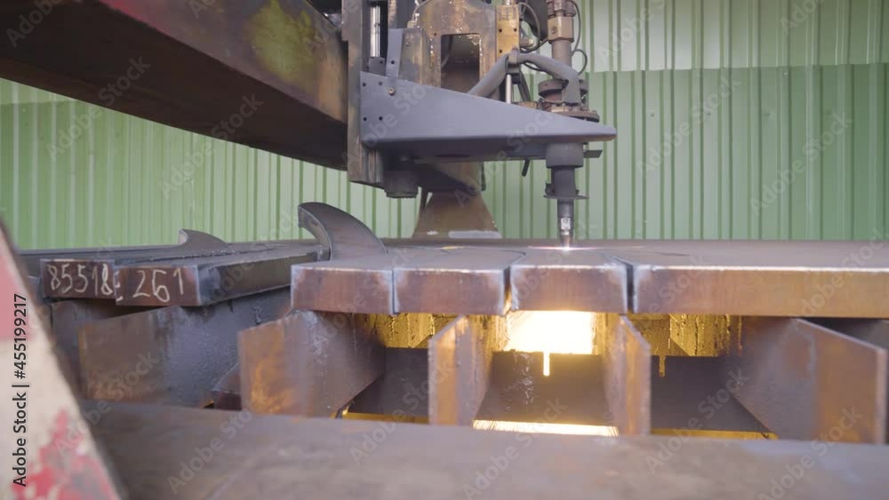 Automatic CNC cutter working on sheet metal. Panning shot Automatic CNC cutter working on sheet metal. Panning shot