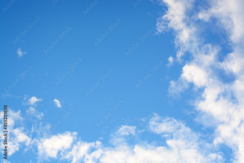 Background with white clouds from the corner edge and blue sky Background with white clouds from the corner edge and blue sky