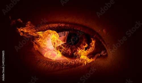 Macro image of human eye with fire flames . Mixed media © Sergey Nivens