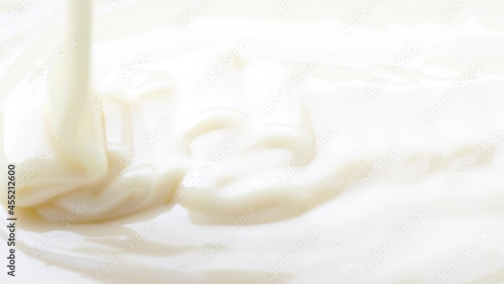 White yogurt, sauce, milk, caramel texture, close up abstract beige cream motion White yogurt, sauce, milk, caramel texture, close up abstract beige cream motion