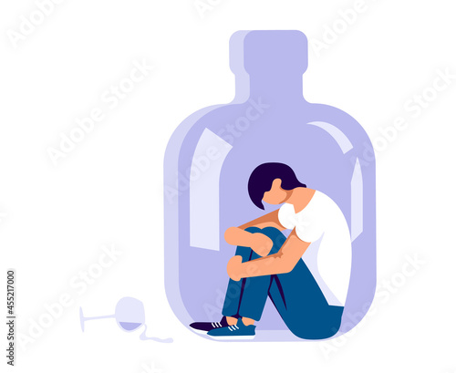 Concept with depressed character is sitting into a alcohol bottle