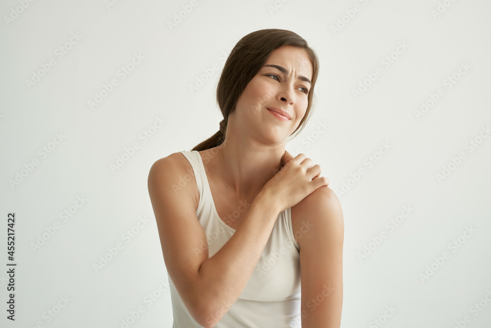 woman in white t-shirt joint pain problems with rheumatism woman in white t-shirt joint pain problems with rheumatism