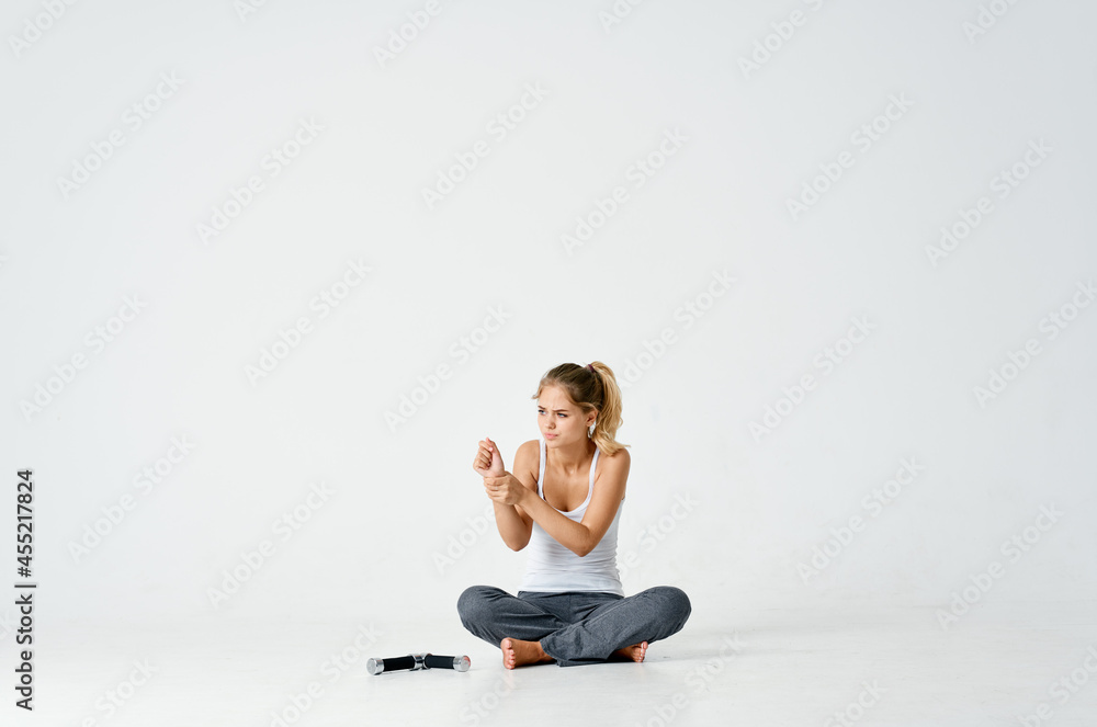 athletic woman sitting on floors dumbbells isolated background motivation fitness athletic woman sitting on floors dumbbells isolated background motivation fitness