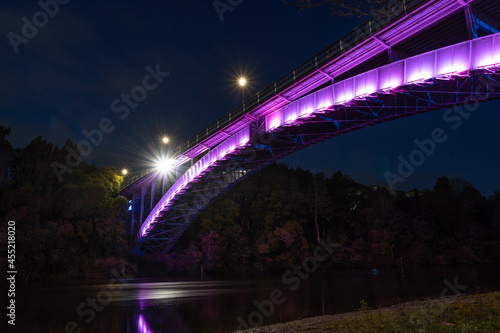 Victoria Bridge lit up at night in Hamilton, New Zealand