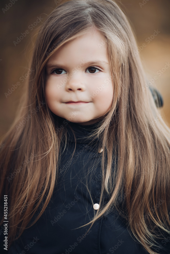 Portrait of cute little girl with long hair and hazel eyes medium close up Portrait of cute little girl with long hair and hazel eyes medium close up