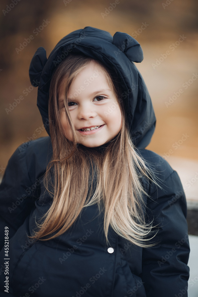 Portrait of beautiful baby goes for a walk in the park in autumn, picture isolated on blur background Portrait of beautiful baby goes for a walk in the park in autumn, picture isolated on blur background