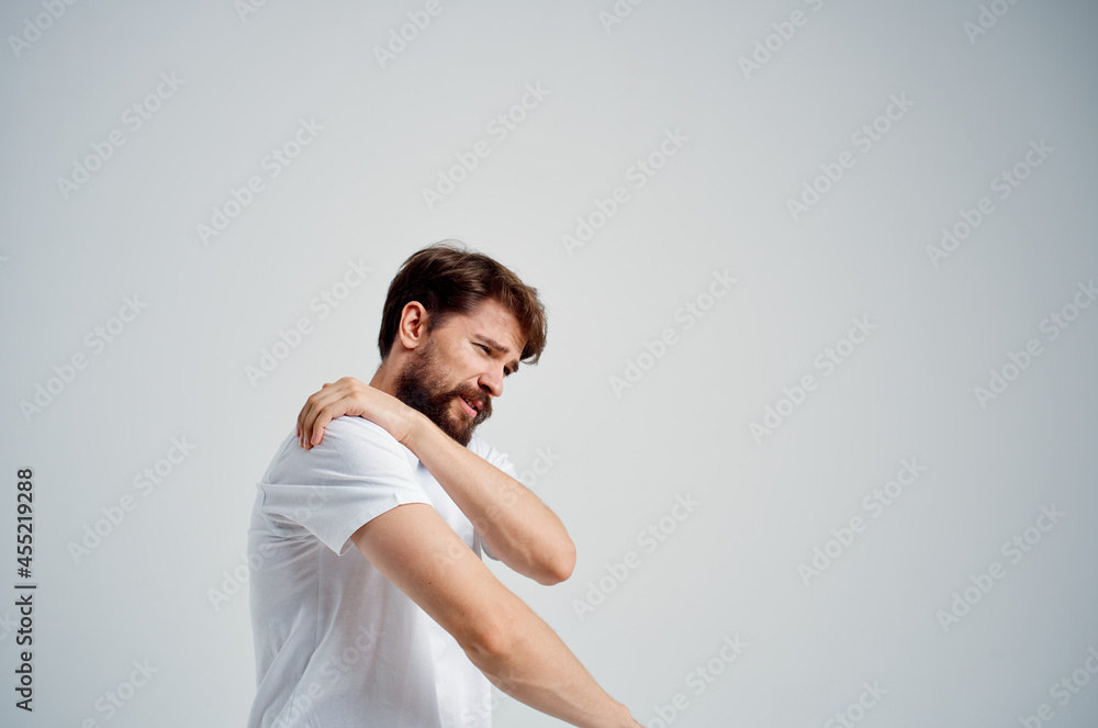 man holding neck arthritis health problems light background man holding neck arthritis health problems light background