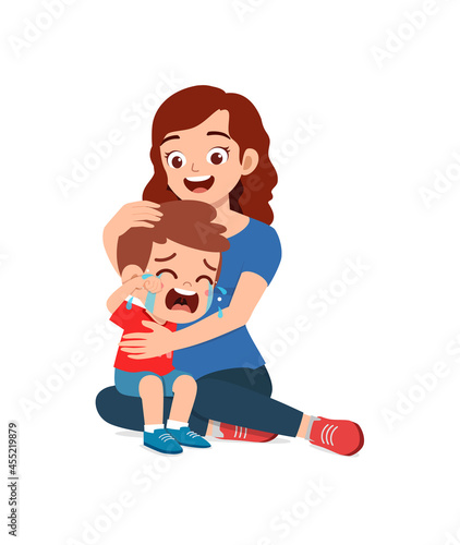 young mother hug crying little boy and try to comfort