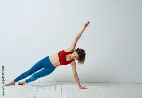 woman in sports uniform workout stretch isolated background