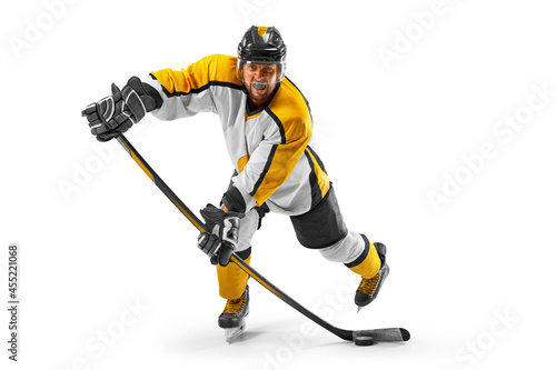 Athlete in action. Professional hockey player in the helmet and gloves on white background. Sports emotions. Hockey concept photo