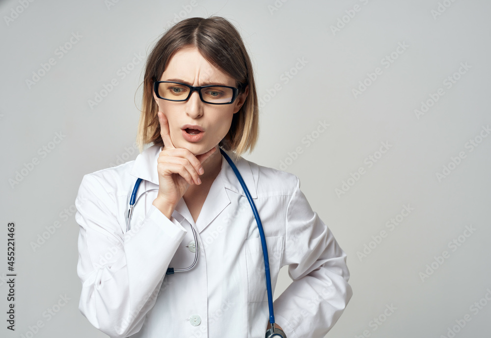female doctor in medical uniform isolated background