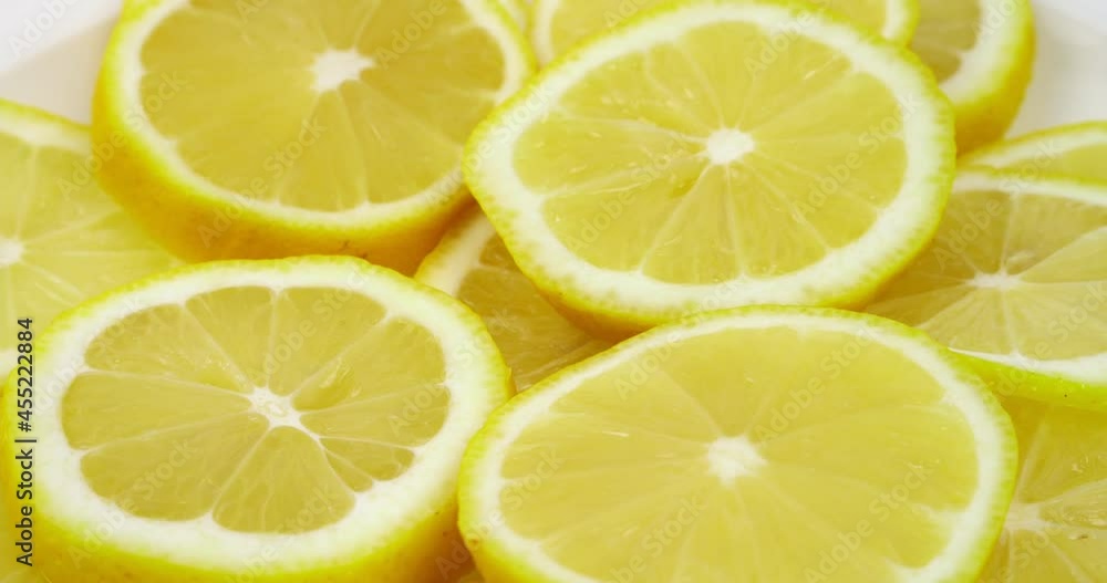 Rotation of yellow lemon slices, 360 degree rotation, close-up of a lemon in a cut. Rotation of yellow lemon slices, 360 degree rotation, close-up of a lemon in a cut.