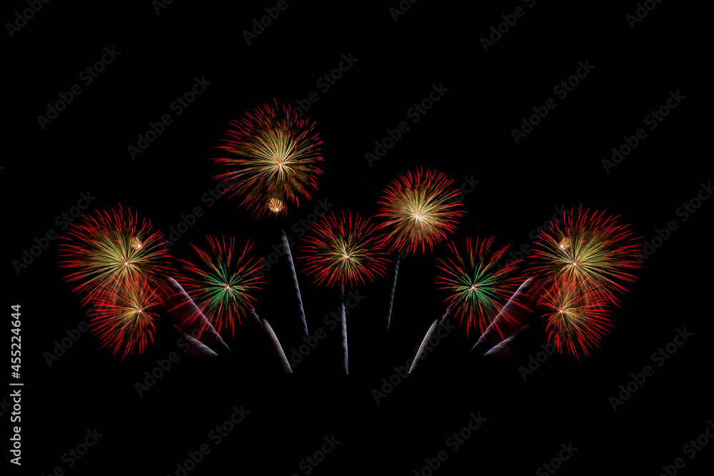 Fireworks of various colors bursting against a black background