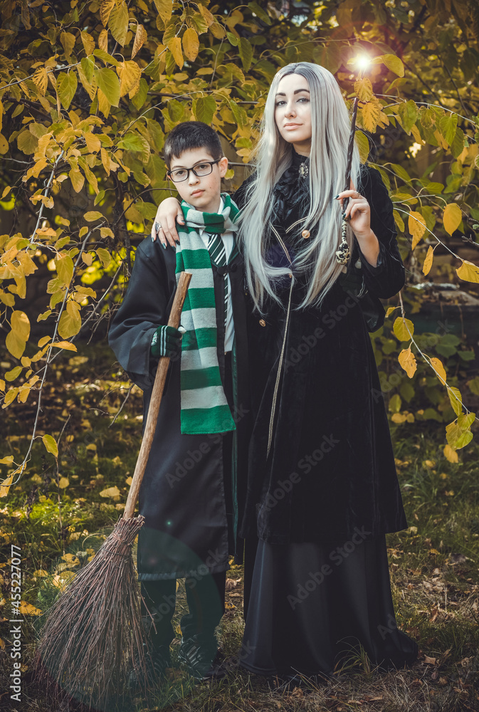 Halloween party ideas, people outfit. Woman and boy from school of wizards and magic