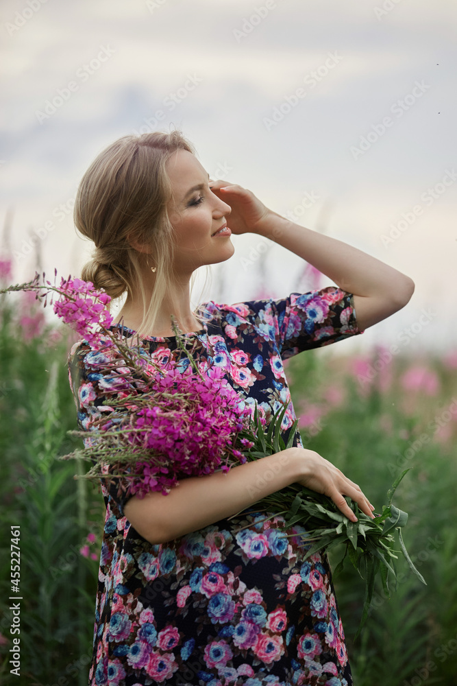 Pregnant woman at 9 months of pregnancy walks in summer in field in village, few days before the birth of the child Pregnant woman at 9 months of pregnancy walks in summer in field in village, few days before the birth of the child