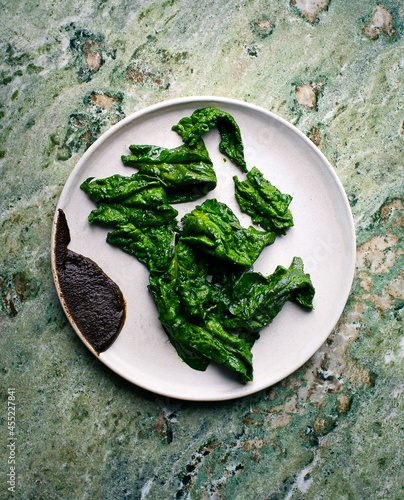 sautéed spinach with fermented black garlic paste