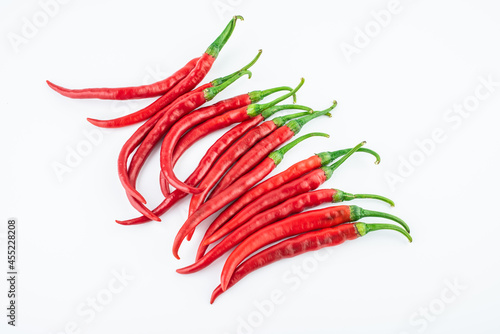 Fresh red peppers on white background