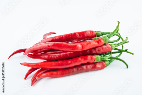 Fresh red peppers on white background