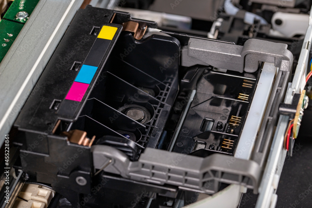 A trolley for attaching ink cartridges to an inkjet printer. View of the printer accessories for printing documents. A trolley for attaching ink cartridges to an inkjet printer. View of the printer accessories for printing documents.