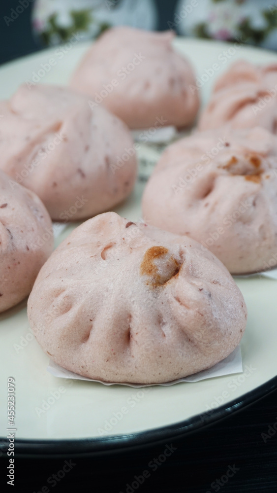 steamed fresh sweet red bean lotus paste bun baozi on dark grey wood background dim sum halal menu steamed fresh sweet red bean lotus paste bun baozi on dark grey wood background dim sum halal menu