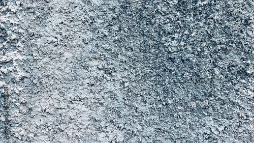 close-up gray concrete wall texture background, cement walls are decorated with plastering techniques to have rough surface like cement dripping for decoration exterior facade building wall