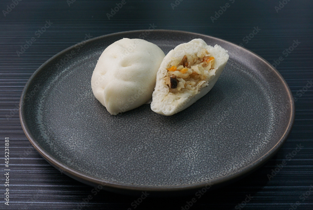 steamed fresh vegetables bun white baozi in leaf shape on dark grey wood background dim sum halal menu steamed fresh vegetables bun white baozi in leaf shape on dark grey wood background dim sum halal menu