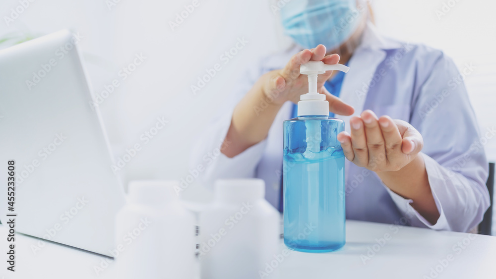 Fototapeta premium Medicine doctor using hand sanitizer gel. protection and prevention Coronavirus global pandemic outbreak