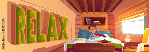 Man relax in bed with book in cozy camping van interior with steaming coffee cup and cookies. Traveler meet morning in modern trailer minibus with moss decor and furniture, Cartoon vector illustration