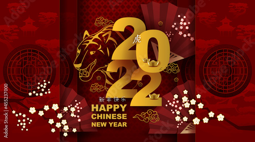 Chinese new year and festivals with red paper cut art and craft on color backgroung with asian elements. translation: chinese new year 2022, year of tiger.