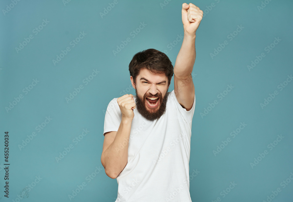 bearded man in a white t-shirt hand gestures anger Lifestyle bearded man in a white t-shirt hand gestures anger Lifestyle