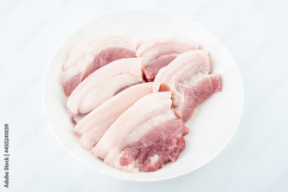 A plate of pork belly cut into pieces