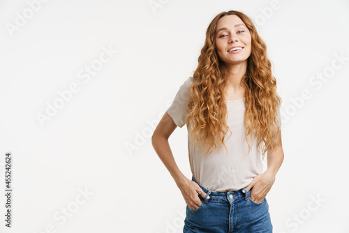 Young ginger woman wearing t-shirt smiling and looking at camera