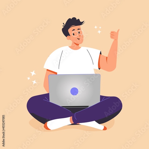 Freelance, Online distant work, internet technologies concept. Happy smiling man cartoon character sitting on floor with legs crossed working on laptop computer and showing thumbs up sign.