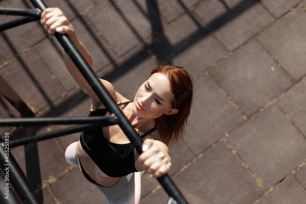 Girl take care of health. The red-haired model advertises sportswear. Active lifestyle.