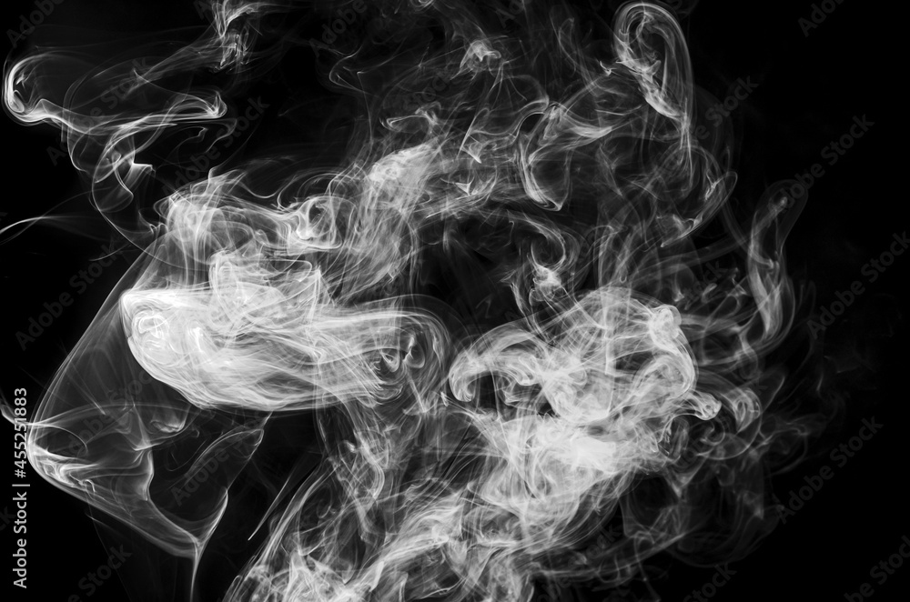 Fototapeta premium Gray, white smoke in the dark on a black background, isolated steam, fume, dry ice