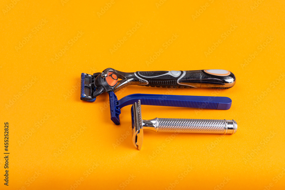 The evolution of the shaving machine on a yellow background. Razors