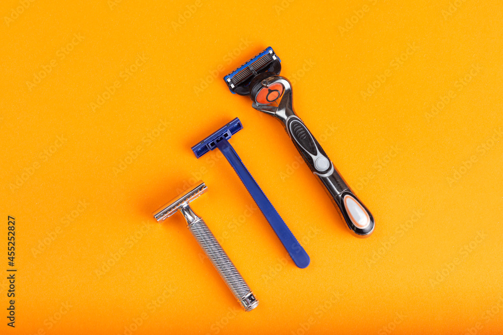 The evolution of the shaving machine on a yellow background. Razors